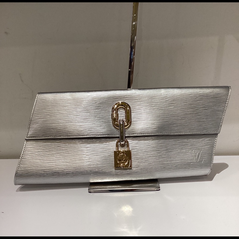 🔥SOLD🔥RARE Louis Vuitton Silver/Gold Epi
Leather Blade Clutch